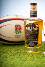 Load image into Gallery viewer, A bottle of The Fine Drop Margaux Cask Finish English Single Malt Whisky (46% ABV), pictured with an official ball of England Rugby. Celebrating the iconic drop goal that saw the men's team of England Rugby become World Champions in 2003