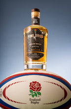 Load image into Gallery viewer, A bottle of The Fine Drop Margaux Cask Finish English Single Malt Whisky (46% ABV), pictured on top of an official ball of England Rugby. Celebrating the iconic drop goal that saw the men&#39;s team of England Rugby become World Champions in 2003
